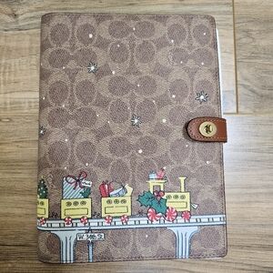 NWOT Coach Signature Canvas Notebook with Holiday Train